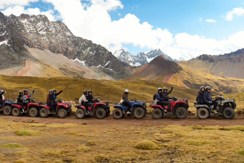 Travelers riding ATVs towards Rainbow Mountain in Cusco, Peru