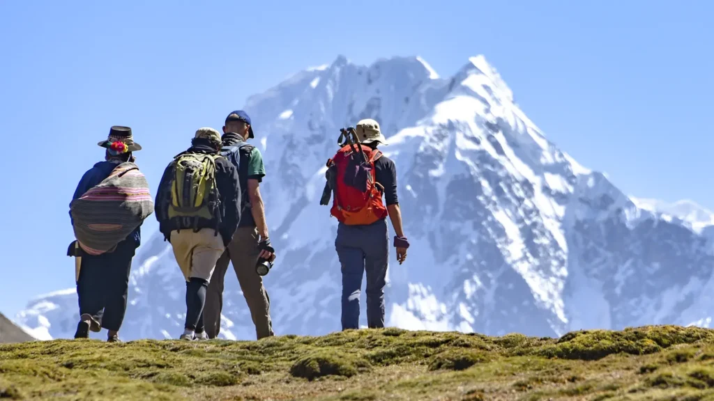 Hikers walking toward Ausangate Mountain during the 5-day Ausangate Trek in Peru