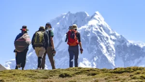 Hikers walking toward Ausangate Mountain during the 5-day Ausangate Trek in Peru