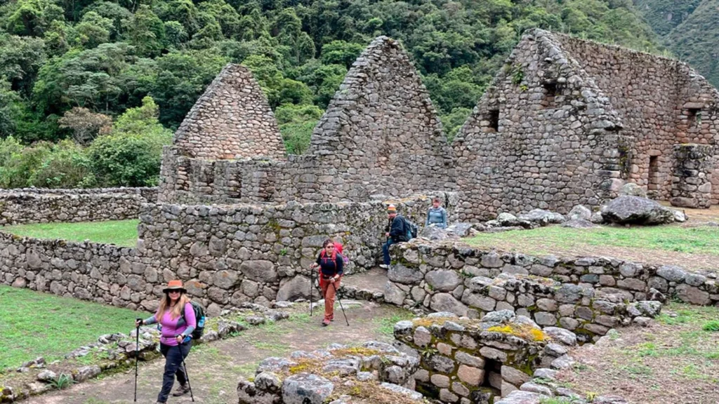 Hikers exploring the Chachabamba archaeological site along the Inca Trail One Day route with Pacha Perú Explorers