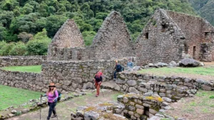 Hikers exploring the Chachabamba archaeological site along the Inca Trail One Day route with Pacha Perú Explorers