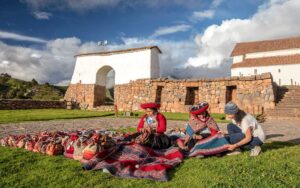 Local women demonstrating traditional alpaca wool weaving in Chinchero, Sacred Valley Peru