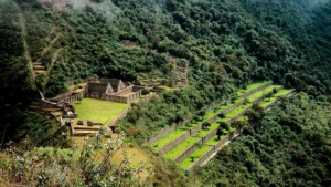 Hiker exploring the ancient Inca stone structures of Choquequirao on the 6-day trek to Machu Picchu.