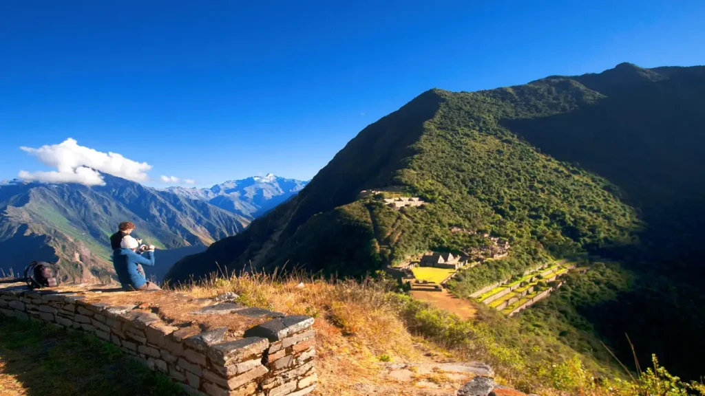 Traveler admiring the scenic overlook of Choquequirao during the 6-day trek to Machu Picchu.