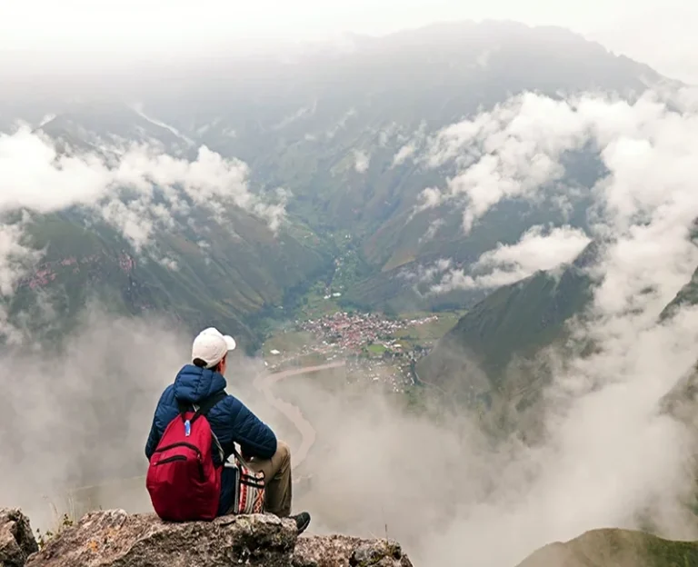 Hiker overlooking the Sacred Valley during the Huchuy Qosqo Trek to Machu Picchu