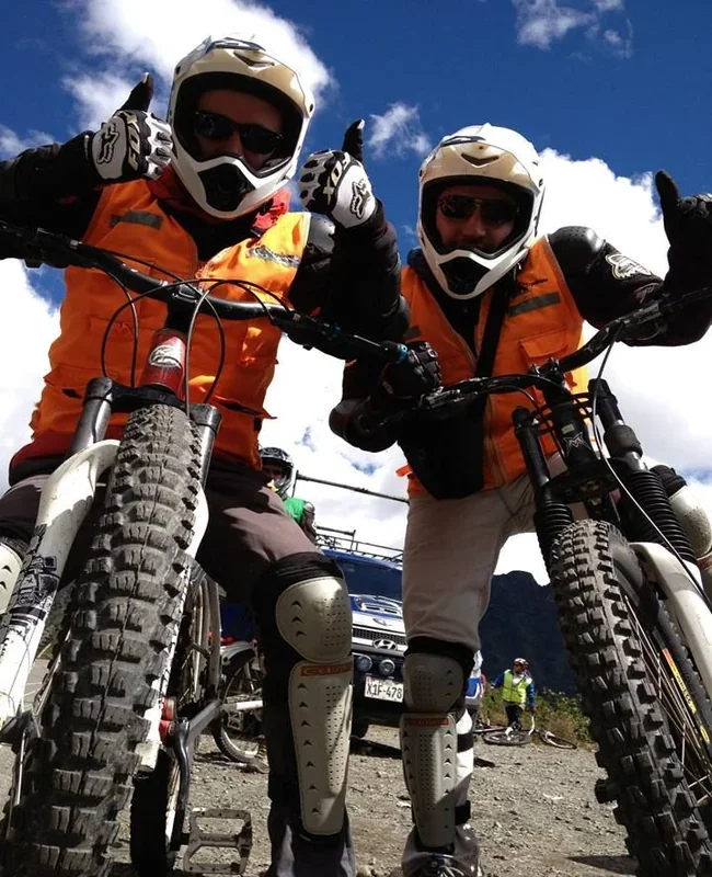 Travelers mountain biking during the Inca Jungle Tour to Machu Picchu – Pacha Peru Explorers