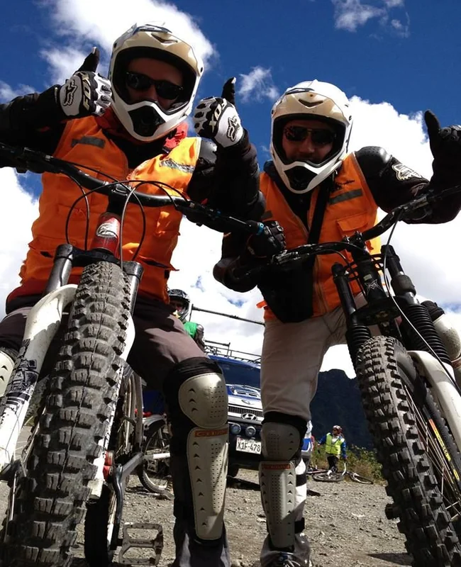 Travelers enjoying mountain biking during the Inca Jungle tour on the way to Machu Picchu