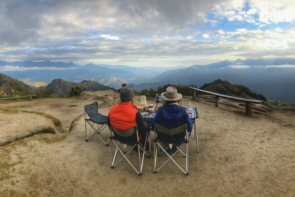 Hikers reaching a high Andean mountain pass during the Private Inca Trail 4 Days Tour with Pacha Perú Explorers