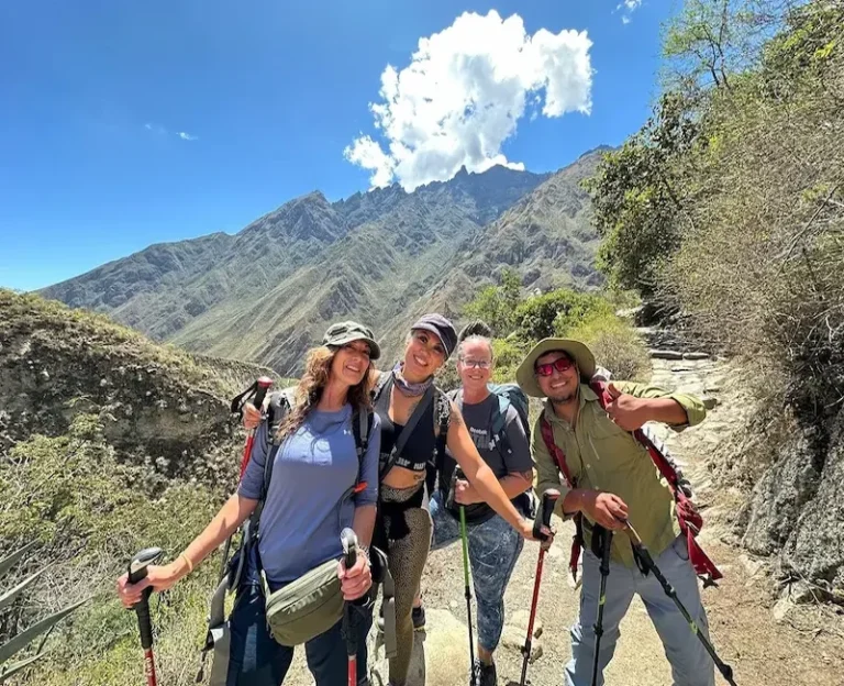Hikers on the Inca Trail trekking to Machu Picchu with mountain views – Pacha Peru Explorers