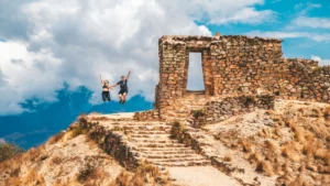 Traveler exploring Intipunku on a trekking tour in Ollantaytambo, Cusco Peru.