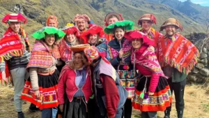 Travelers sharing a cultural moment with an Andean local community during the Lares Trek