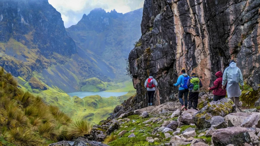 Hikers crossing a high mountain pass on the Lares Trek in the Andes