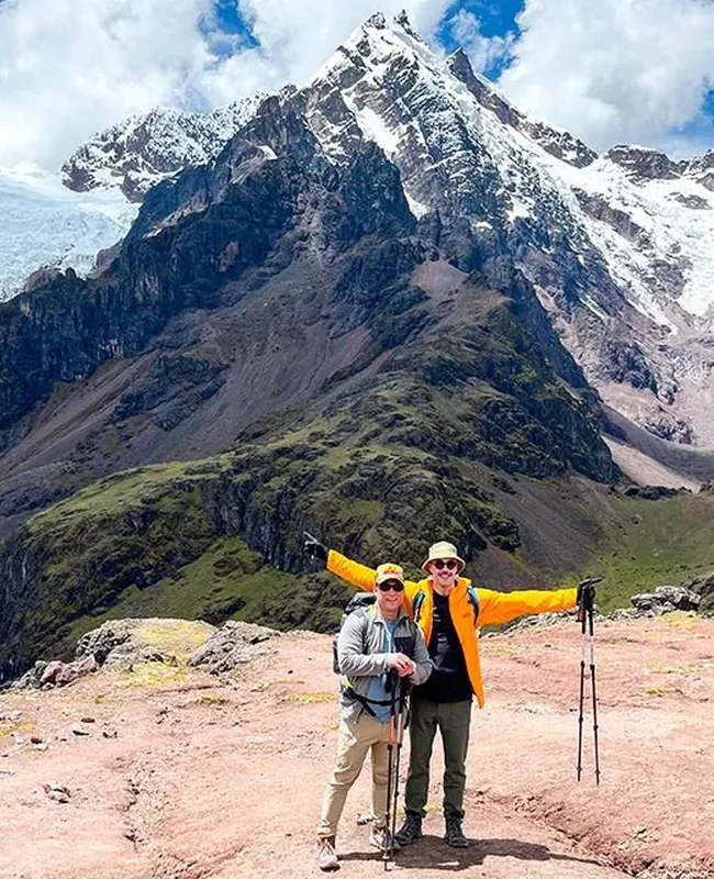 Hikers on Lares Trek Machu Picchu with snowy Andean mountains