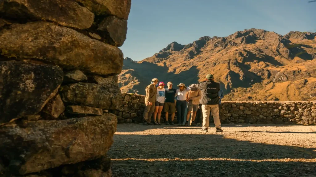 Group enjoying a Luxury Inca Trail guided tour with panoramic Andean mountain views – Pacha Peru Explorers