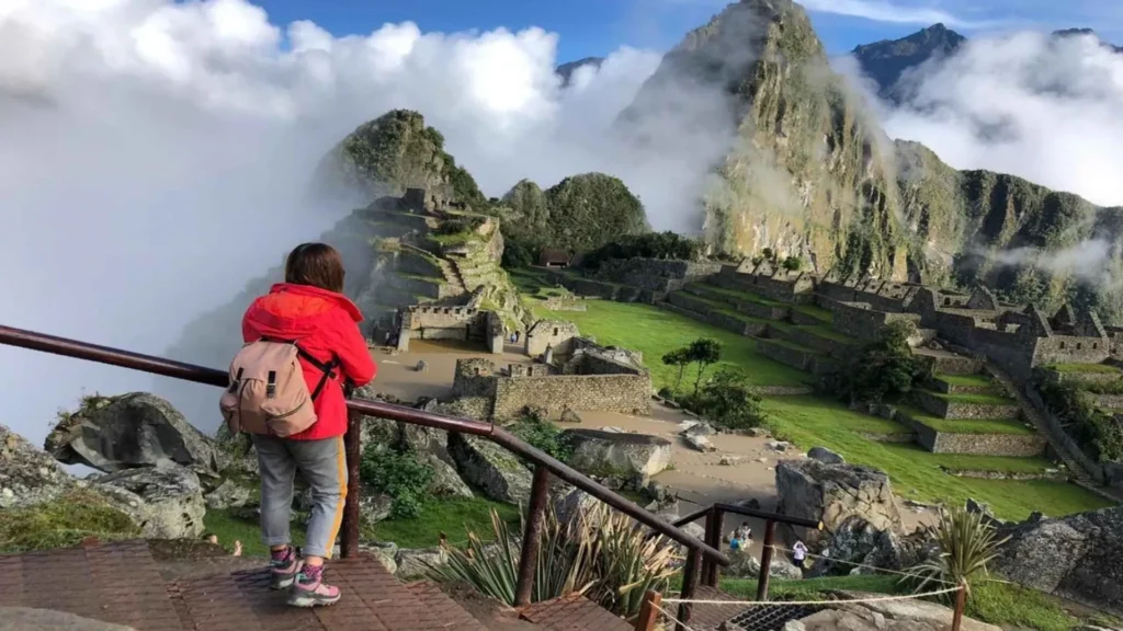 Tour guide explaining Machu Picchu ruins during a guided tour