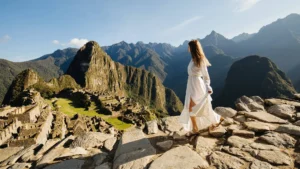 Woman enjoying a luxury Machu Picchu tour with panoramic Andean mountain views – Pacha Peru Explorers