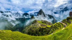 Panoramic view of Machu Picchu Inca citadel surrounded by misty mountains