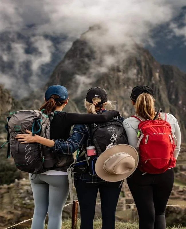 Travelers hiking together on a Machu Picchu trekking route with Pacha Peru Explorers