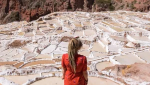 Traveler overlooking the Maras Salt Mines in the Sacred Valley, Peru – Pacha Peru Explorers