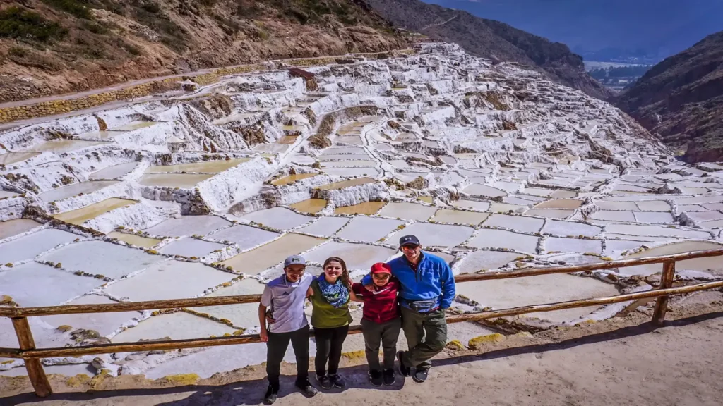 Visitors at the Maras Salt Mines in the Sacred Valley during a guided tour – Pacha Peru Explorers