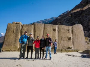 Visitors posing at Ollantaytambo Inca archaeological site during a Sacred Valley Day Tour in Peru