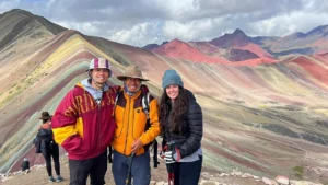 Travelers with local guide at Rainbow Mountain Vinicunca in Peru
