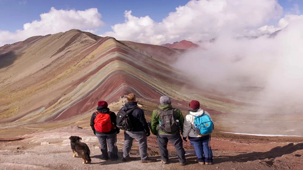 Hikers at the viewpoint of Rainbow Mountain Vinicunca near Cusco, Peru