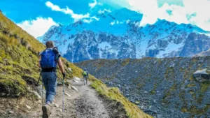 Hikers reaching the Salkantay Pass on the Salkantay Trek to Machu Picchu