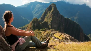 Traveler watching the sunrise over Machu Picchu after completing the Short Inca Trail 2 Days with Camping.