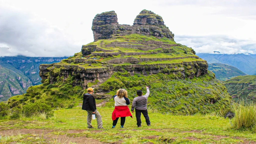 Panoramic view of Waqrapukara archaeological site during a one day trek from Cusco.