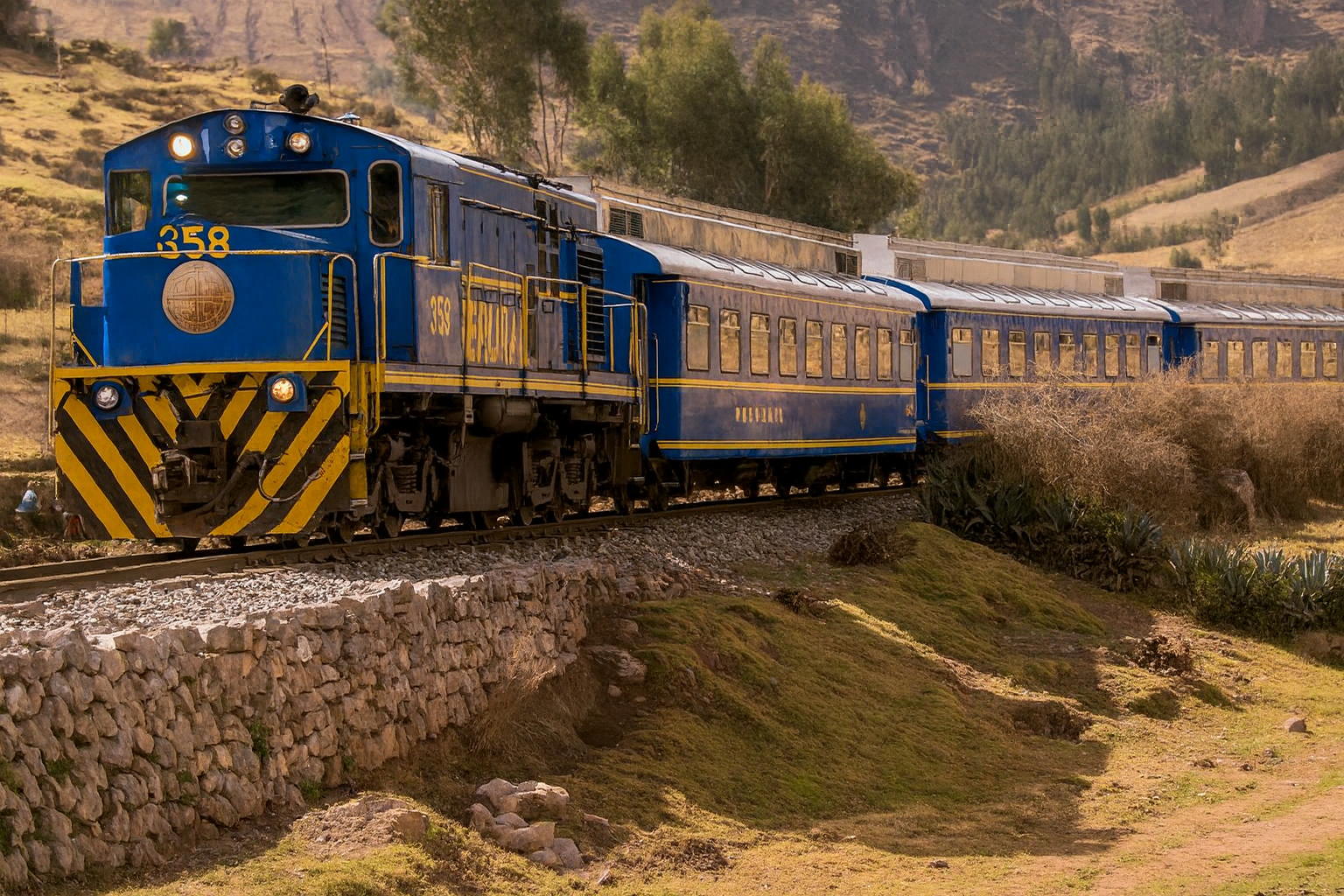Travelers arriving at Machu Picchu by train with Pacha Perú Explorers, enjoying scenic views of the Andes